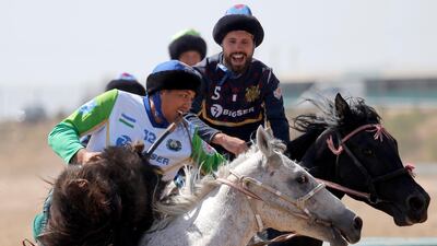 Uzbek and French horsemen take part in kok-boru. EPA