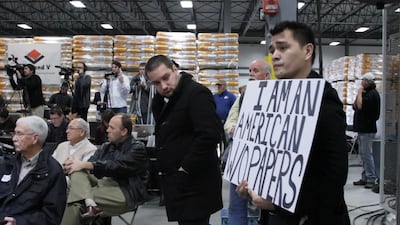 A scene from the film Documented showing immigration activist Jose Antonio Vargas, right, at a Mitt Romney presidential campaign rally in Cedar Rapids, Iowa. Courtesy Apo Productions