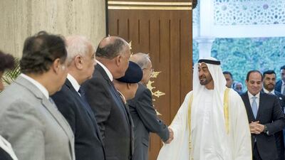 Sheikh Mohammed bin Zayed, Crown Prince of Abu Dhabi and Deputy Supreme Commander of the UAE Armed Forces (2nd R), greets a guest, during an official visit to Egypt on April 10, 2018. They are seen with Abdel Fattah El Sisi, President of Egypt (R). Rashed Al Mansoori / Crown Prince Court - Abu Dhabi
