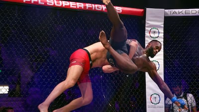 Johnny Eblen wrestles Fabian Edwards to the canvas during their Bellator middleweight title bout. Chris Whiteoak / The National
