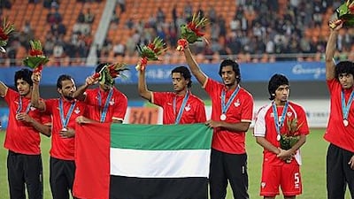 The UAE team celebrate after winning the men's football silver medal at the Asian Games.