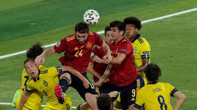 Spain's Aymeric Laporte goes for a header during the Euro 2020 Group E match between Spain and Sweden, at La Cartuja stadium in Seville, Spain. AP