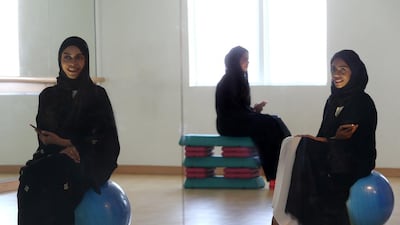Bouncing back. After their yoga instructor moved to Dubai, sisters Amna, left, Hind, centre, and Mariam Balfaqeh felt at a bit of a loss. Not for long, though. They got together to open Tone Fitness, a studio for women to build healthy bodies and minds. Delores Johnson / The National