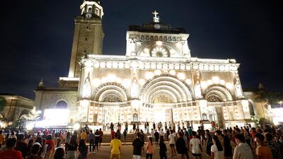 Manila Cathedral is lit up for mass on December 16. EPA