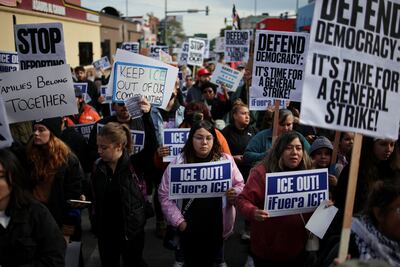 Protesters march against Immigration and Customs Enforcement in the mainly Mexican-American Little Village neighbourhood of Chicago on October 25. Reuters