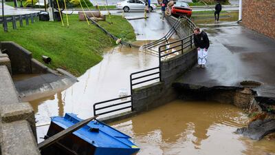 Residents assess flood damage in Boone, North Carolina, on September 27. Heavy rains caused severe flooding in many parts of the Blue Ridge Mountains. Getty Images / AFP