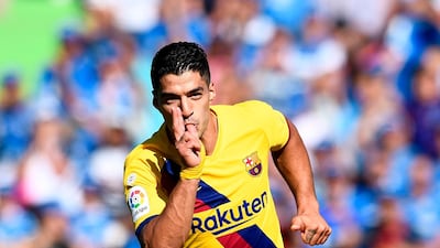 Luis Suarez celebrates scoring against Getafe in September 2019. AFP