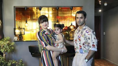Areeb Hassan with his wife Fatima and daughter Aairah at their apartment in International City in Dubai. Pawan Singh / The National