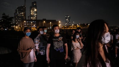 People gather to watch fireworks on the banks of the East River to celebrate Independence Day in Queens, New York City. AFP