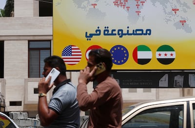 Syrian men on a street in Damascus. AP