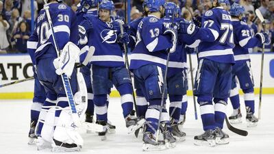 Tampa Bay Lightning players celebrate after defeating the Montreal Canadiens and thus eliminating the last remaining Canadian team from the Stanley Cup. Chris O'Meara / AP Photo
