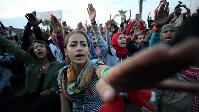 Demonstrators gesture as they block a road during ongoing anti-government protests in the port city of Sidon, Lebanon. Reuters
