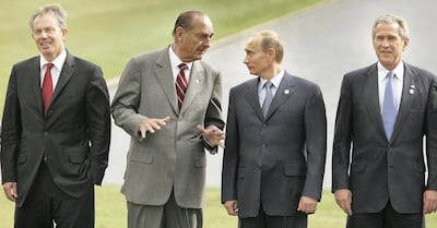 Britain's former prime minister Blair, late French president Jacques Chirac and Russia's President Vladimir Putin pose for a group photograph in St Petersburg, Russia. Getty Images