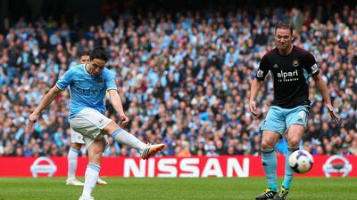 Samir Nasri of Manchester City scores the first goal against West Ham United at the Etihad Stadium on Sunday. Alex Livesey / Getty Images