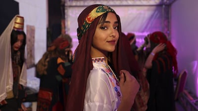 A Palestinian woman, wearing a traditional embroidered dress, attends an event celebrating the registration of Palestinian embroidery on the Unesco Cultural Heritage List, in the West Bank city of Ramallah. AFP