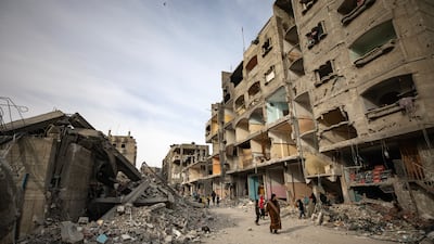 Destroyed residential buildings near the ruins of Al Farouq Mosque after it was hit by an Israeli air strike. EPA