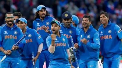 Virat Kohli, centre, and his India teammates celebrate beating England in the ICC Champions Trophy final on Sunday at Edgbaston cricket ground in Birmingham, England. Jon Super / AP Photo