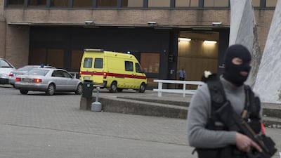A special forces officer stands guard as a police convoy and ambulance thought to be carrying captured fugitive Salah Abdeslam arrives at the federal penitentiary in Bruges, Belgium, on March 19, 2016. Salah Abdeslam has been charged with “terrorist murder” by Belgian authorities and his lawyer vowed to fight any attempt to extradite him to France to stand trial for the slaughter of 130 people. Geoffroy Van der Hasselt/AP Photo