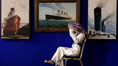 A council employee models the dress worn by Kate Winslet in the film Titanic in front of exhibition of Titanic artefacts and memorabilia last week at the City Hall in Belfast, Northern Ireland.