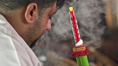 Smoking shisha at the Al Saher Coffee Shop in Fujariah City. Jeff Topping / The National