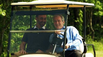 US president George W Bush drives Sheikh Mohammed bin Zayed in a golf buggy at the Camp David retreat in Maryland. Jamie Rose for The National / June 26, 2008