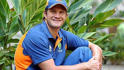 Australian batsman Shane Watson poses for phototographers after addressing a press conference in Bangalore on March 8, 2011. Australia is in Bangalore preparing for the next. William West / AFP