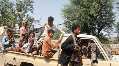 Pro-government fighters ride on the back of a truck at Al Dhabbab area after they seizing it from Houthi fighters outside the southwestern city of Taez, Yemen on August 21, 2016. Anees Mahyoub/Reuters