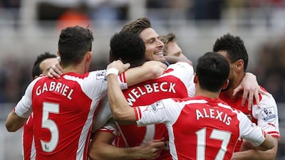 Arsenal players Gabriel Paulista, Danny Welbeck, Olivier Giroud and Alexis Sanchez celebrate after a goal in their Premier League win over Newcastle United on Saturday. Andrew Yates / Reuters / March 21, 2015