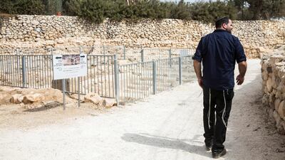Israeli Jewish settler Haim Blycher walks along the site. "The site tells the real story by which the Jewish people were born and lived thousands of years until it was expelled," says Blycher, a lawye.