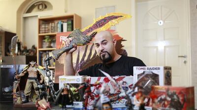 Emirati Omar Sharif with some of his prized collectables in his Mirdif home. Mr Sharif is the founder of Geeky Lizard, a table-top gaming store and hobby shop which is supported by Khalifa Fund. Sarah Dea / The National