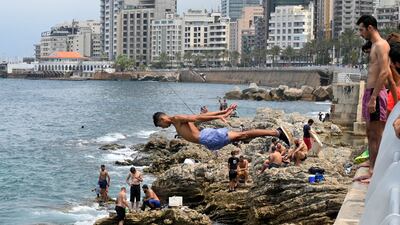 Youths at the Al Manara Corniche on a sunny day in Beirut, Lebanon.