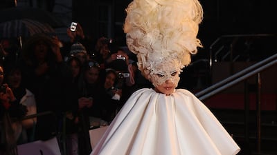 Lady Gaga wore a Francesco Scognamiglio caped dress with a lace mask by Philip Treacy for The Brit Awards 2010 at Earls Court on February 16, 2010 in London, England. Getty Images