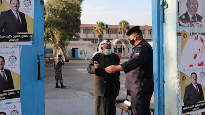 A man enters a polling station as Jordanians began voting in a parliamentary election. AP