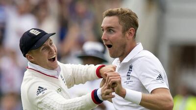 England’s Stuart Broad, right, celebrates with Joe Root after a catch by Ben Stokes dismisses Australia’s Adam Voges. Jon Super / AP Photo