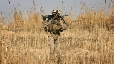 A US marine patrols in a farmland area in southern Afghanistan. The US is seeking ways to clear the Taliban out of their strongholds in the region. AFP PHOTO/PATRICK BAZ
