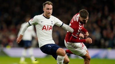 Christian Eriksen vies for the ball against Middlesborough's Lewis Wing. EPA