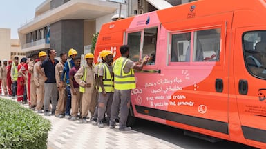 Workers in Dubai queue at an Al Freej Fridge van. Photo: Mohammed Bin Rashid Maktoum Global Initiatives/Ferjan Dubai