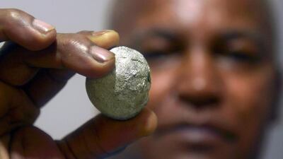 A Colombian gold trader shows a piece of gold in the municipality of Segovia. Raul Arboleda / AFP