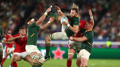 Steven Kitshoff of South Africa helps teammate RG Snyman win a high ball under pressure from Alun Wyn Jones of Wales during the Rugby World Cup 2019 Semi-Final match between Wales and South Africa at International Stadium Yokohama Yokohama, Kanagawa, Japan. GETTY IMAGES