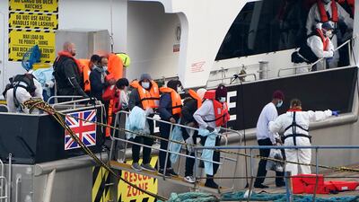 A group of people thought to be migrants are brought in to Ramsgate, Kent, by Border Force officers, following a small boat incident in the Channel. PA