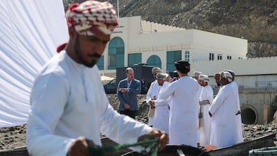 Prince William meets with officials from Oman's Ministry of Fisheries during a visit to Muscat. Reuters