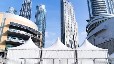 Media trucks and tents set up for Downtown Dubai New Year’s Eve celebrations. Reem Mohammed / The National