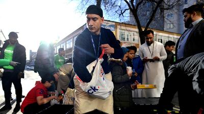 Volunteers at the East London Mosque, in conjunction with Muslim Aid, pack food to feed homeless in London. REUTERS