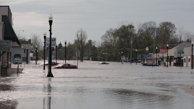 Floodwaters along a street in downtown Sanford, Michigan. TC VORTEX via REUTERS