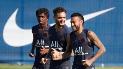 Neymar with Layvin Kurzawa and teammates during training. Reuters