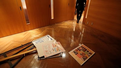 Posters lie on the floor after they fell from the walls of a hotel following a strong earthquake in Iwaki, Fukushima prefecture, Japan February 13, 2021. REUTERS