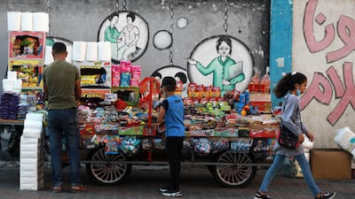 A pupil walks to her UN-run school on the first day of term. Getty Images