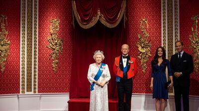 The empty space after the figures of Britain's Prince Harry and Meghan, Duchess of Sussex, were removed next to Queen Elizabeth II, Prince Philip and Prince William and Kate, Duchess of Cambridge, at Madame Tussauds in London. PA Photo