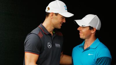 Martin Kaymer of Germany greets Rory McIlroy of Northern Ireland behind the 18th green after the final round of the Abu Dhabi HSBC Golf Championship at the Abu Dhabi Golf Cub on January 18, 2015 in Abu Dhabi, United Arab Emirates. Getty Images