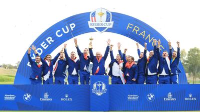 Captain Thomas Bjorn lifts The Ryder Cup as Europe celebrates victory. Getty Images